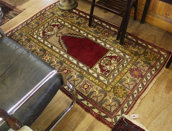 Turkish Konya prayer rug, beige ground and polychrome borders